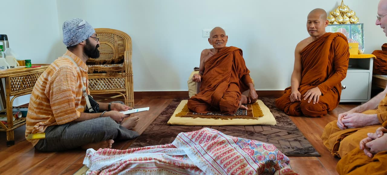 Architect interacting with the monks