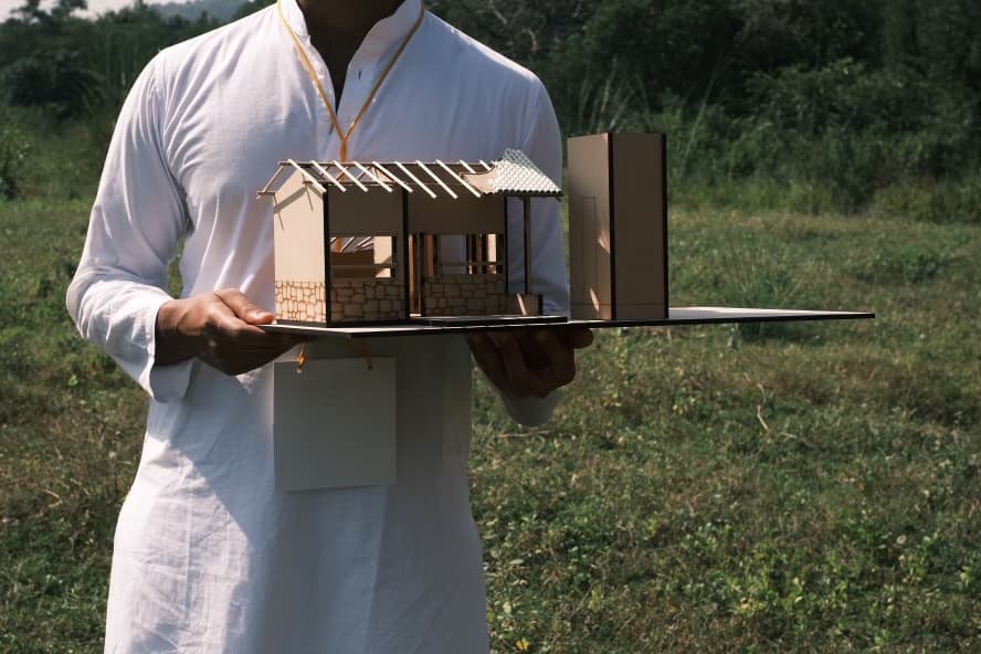 Intern holding a model