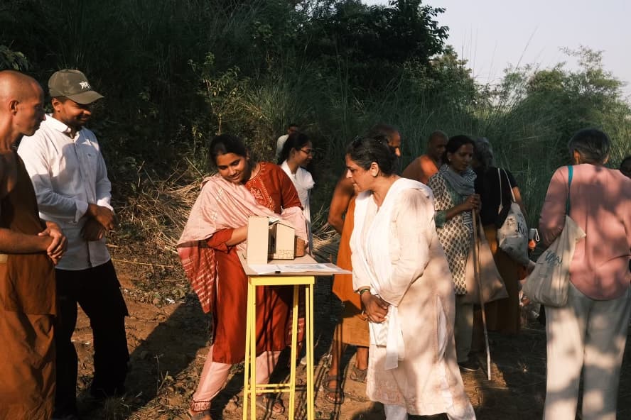 People amused by the model at display